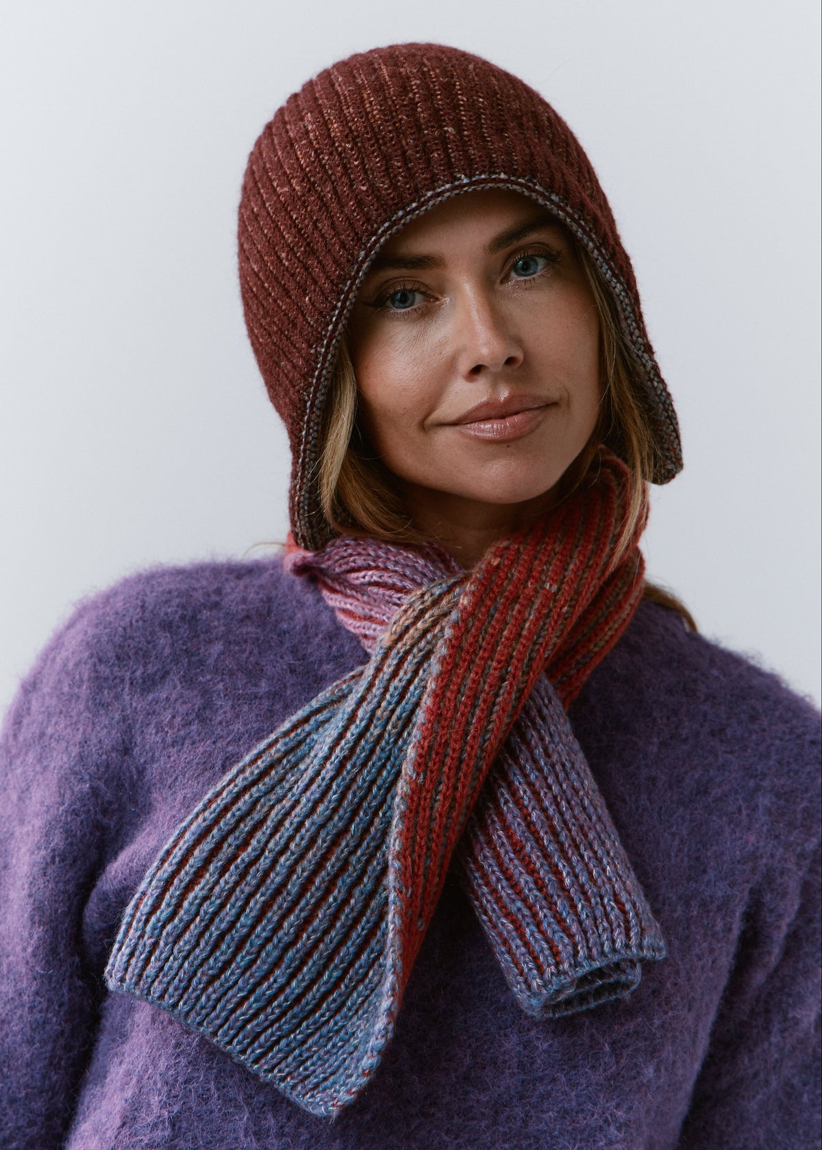 BRIKOLY Lisse Violet multicolor ribbed knit scarf secured around a model's neck in a front view.