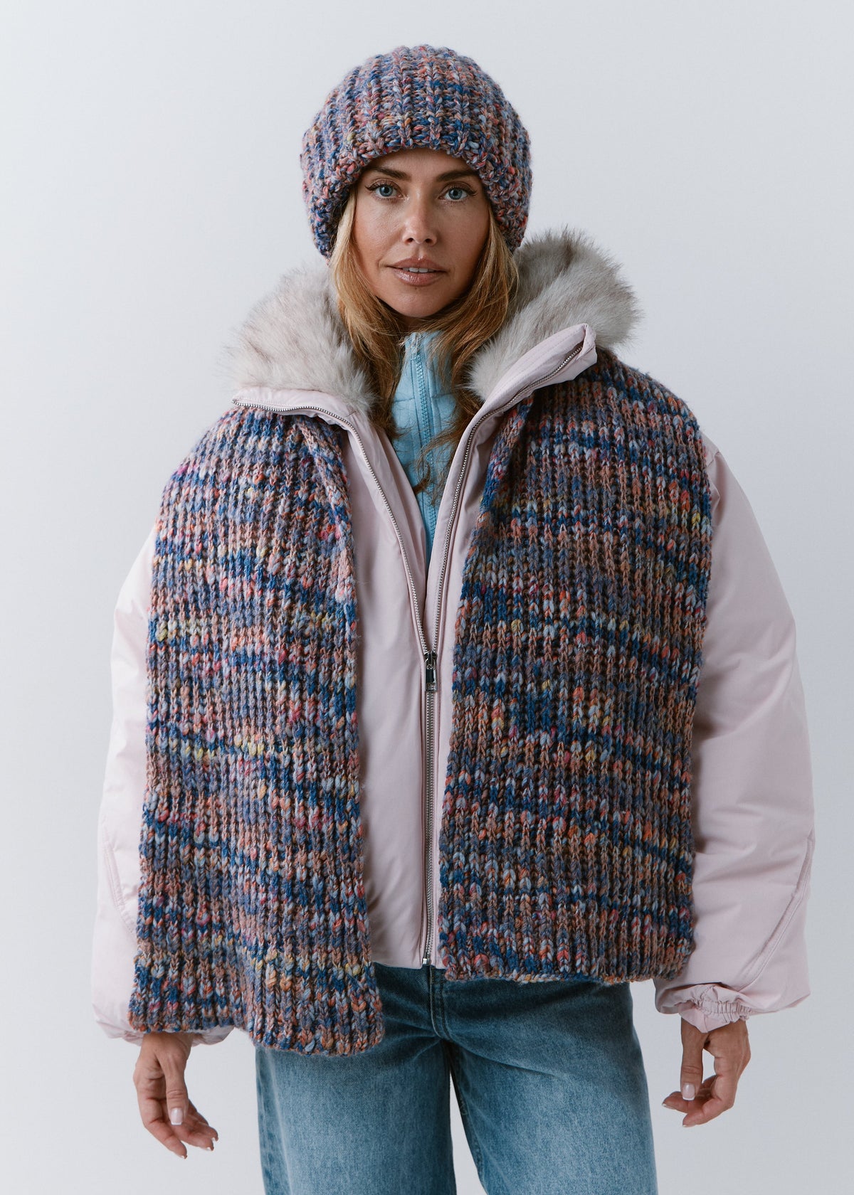 BRIKOLY Pink Blue oversized multicolor knit beanie worn by a model with a matching scarf draped down the front.