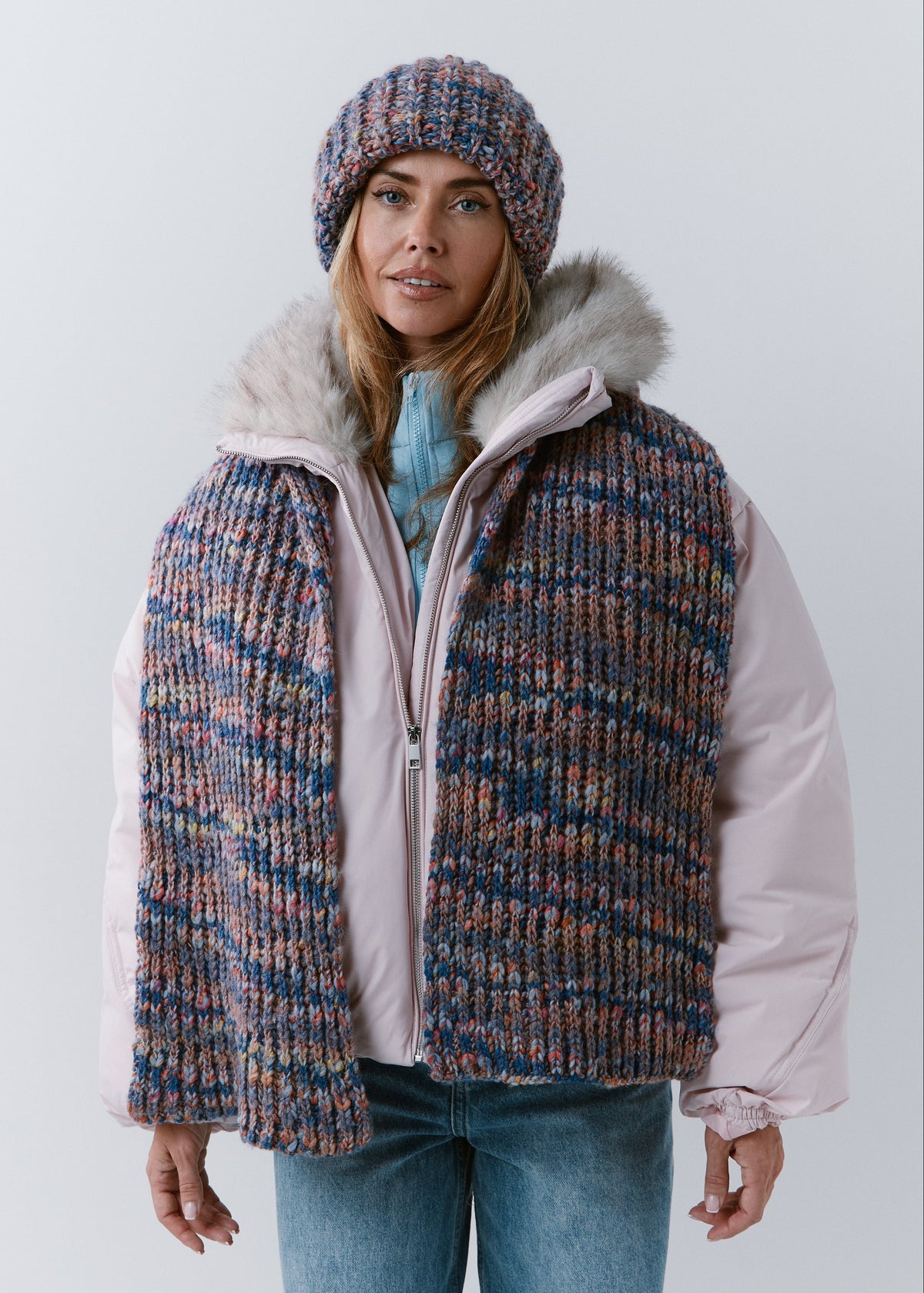 BRIKOLY Pink Blue scarf worn unwrapped over the shoulders, showing its full length down the front.