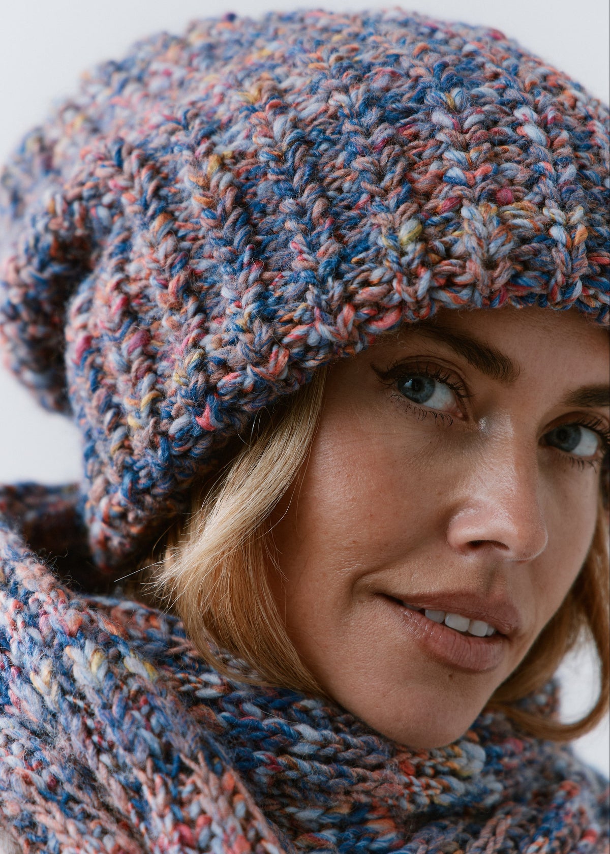 BRIKOLY Pink Blue oversized multicolor knit beanie shown close up to reveal the pink and blue multicolor yarn.