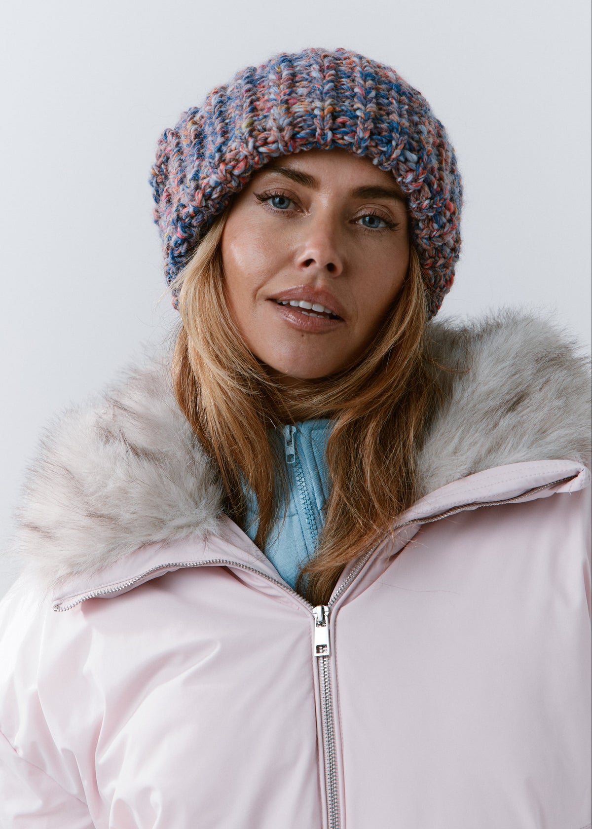 BRIKOLY Pink Blue oversized multicolor knit beanie worn by a model in a front view.