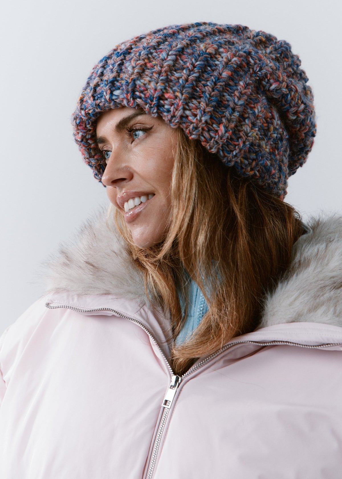 BRIKOLY Pink Blue oversized multicolor knit beanie shown in profile to reveal its ribbed brim and relaxed crown.