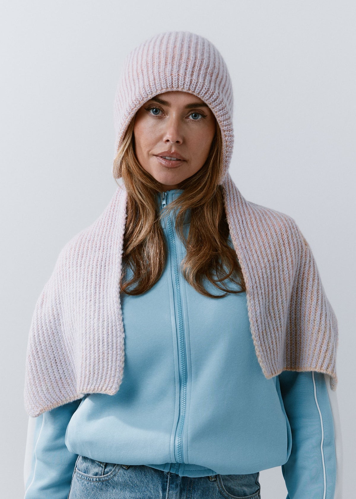 BRIKOLY Lisse Unicorn pale multicolor ribbed knit scarf draped over a model's shoulders with both ends in front.