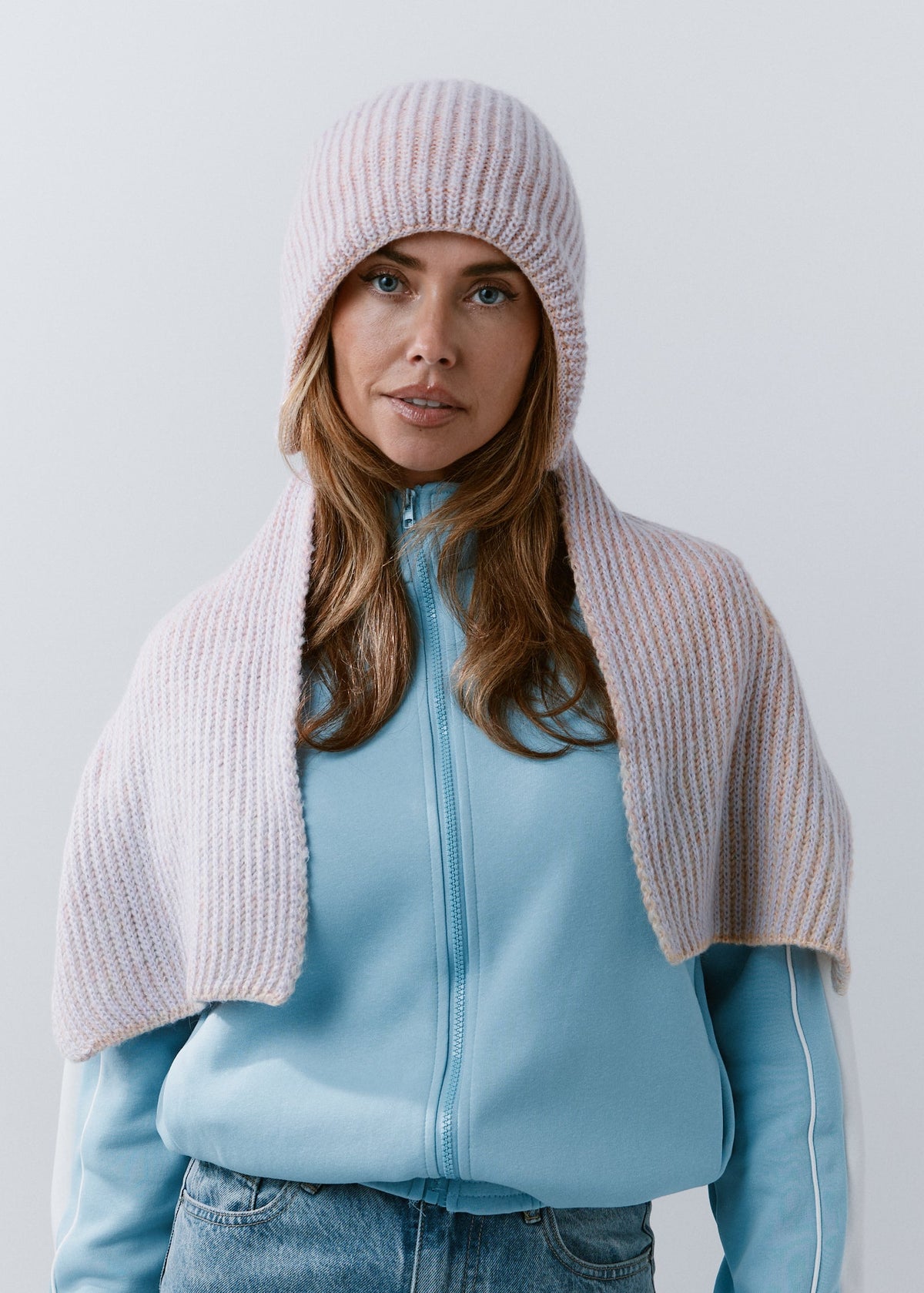 BRIKOLY Lisse Unicorn reversible ribbed knit beanie worn by a model with a matching scarf draped over her shoulders.