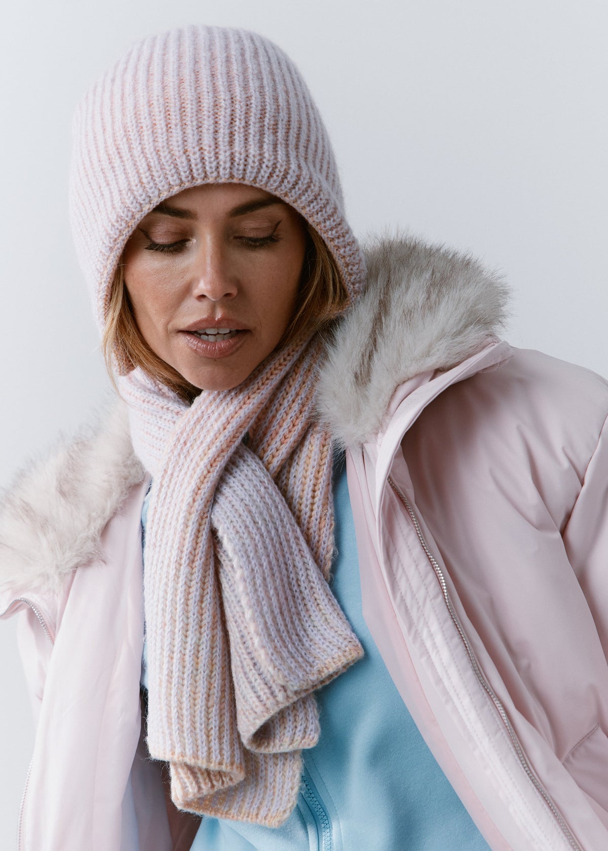BRIKOLY Lisse Unicorn reversible ribbed knit beanie shown in a front view with a matching scarf and pink jacket.