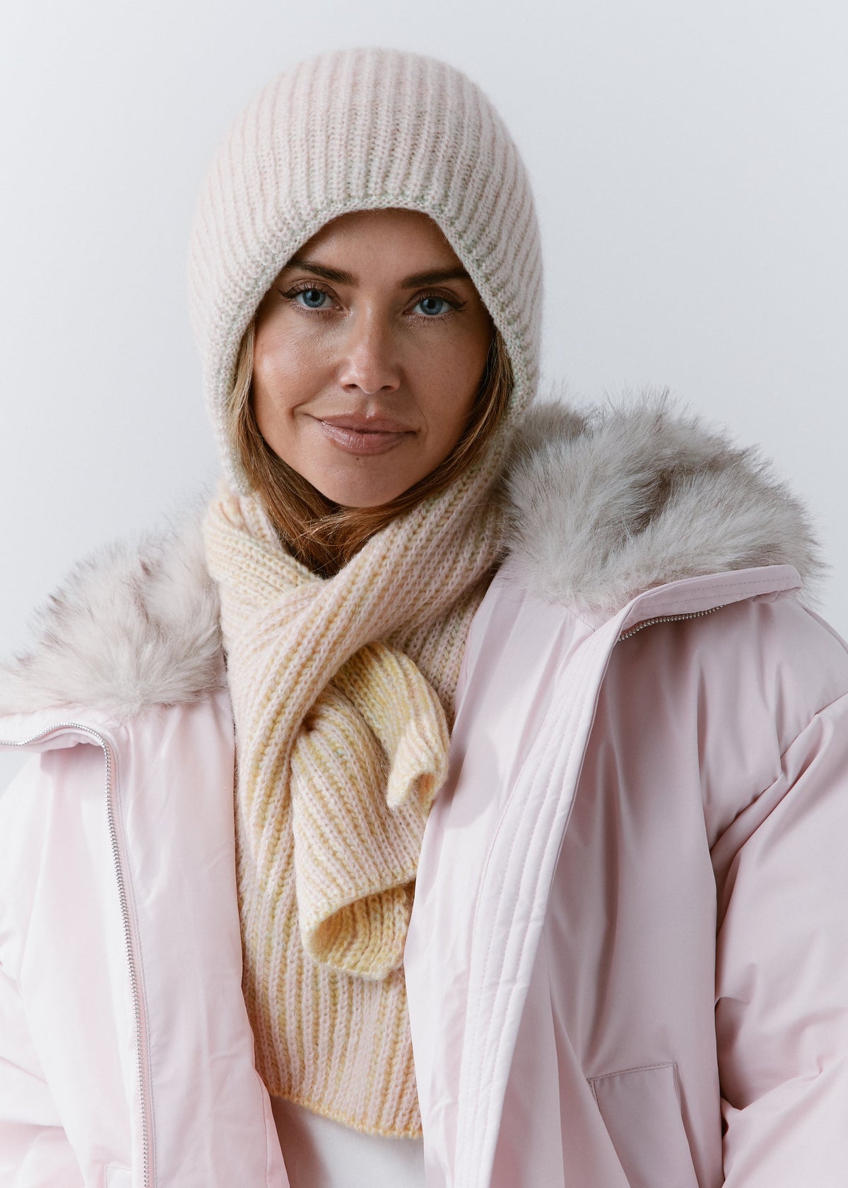 BRIKOLY Lisse Multicolor pale ribbed knit scarf secured around a model's neck with one end hanging in front.