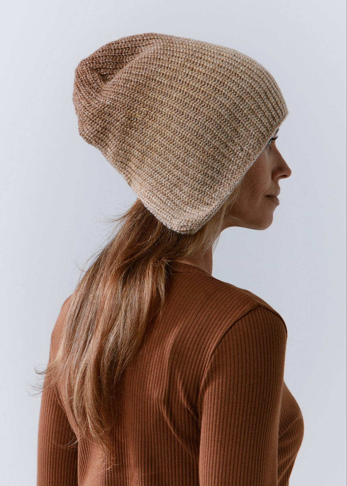 BRIKOLY Lisse Brown reversible ribbed knit beanie shown in profile to reveal its relaxed crown.