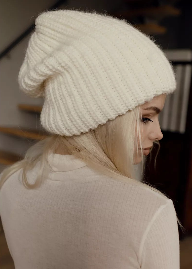 BRIKOLY London White knit beanie shown in a close side view.