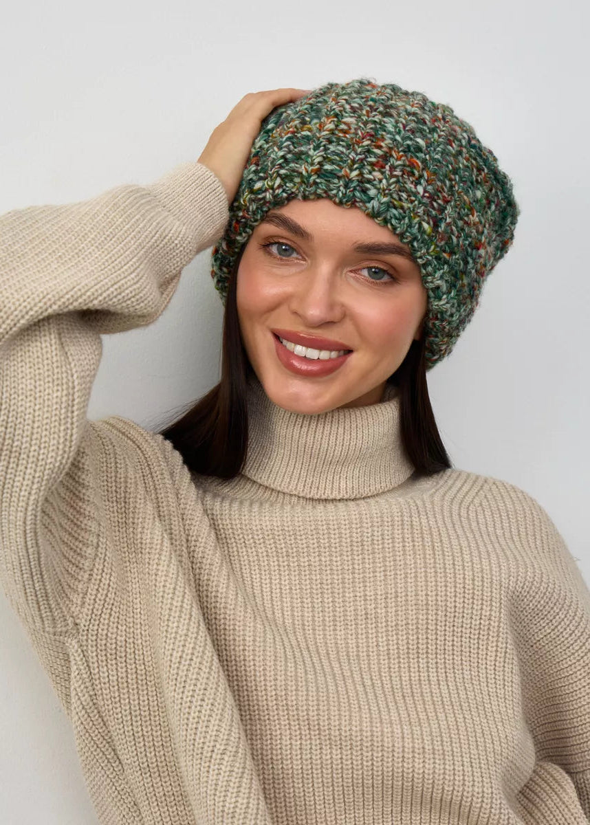 Oversized Green & Orange double-layer wool hat: Smiling portrait with a hand at the crown