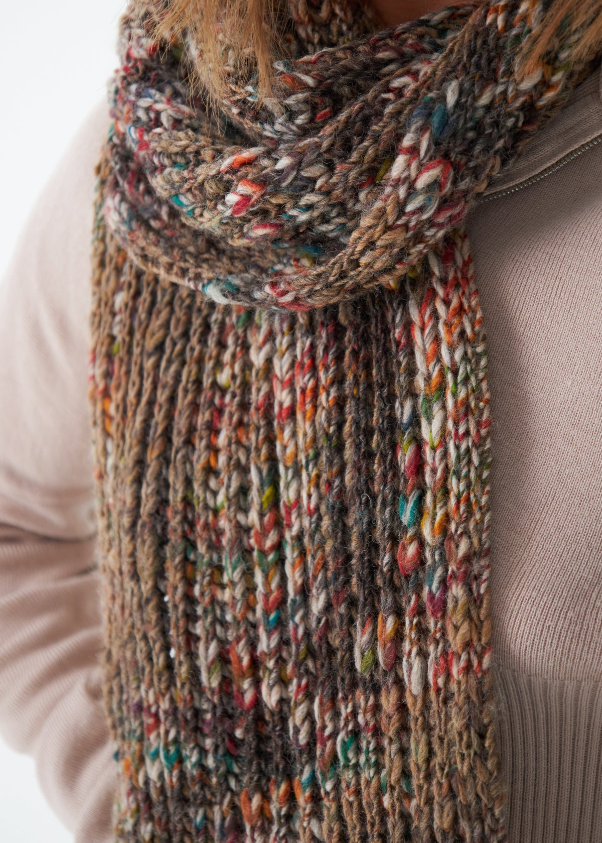 Oversized Multicolor alpaca-wool scarf: Close-up of the ribbed scarf hanging down; beanie sold separately