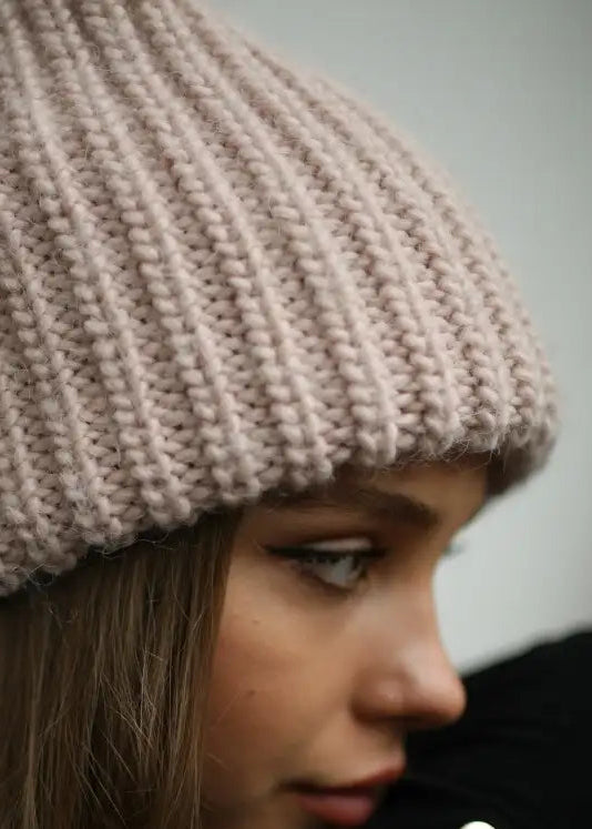 BRIKOLY London Pink knit beanie shown in a detail view of the knit brim.