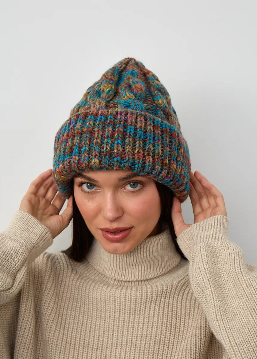 Tokyo Turquoise cable knit wool beanie: Front portrait with hands at the sides