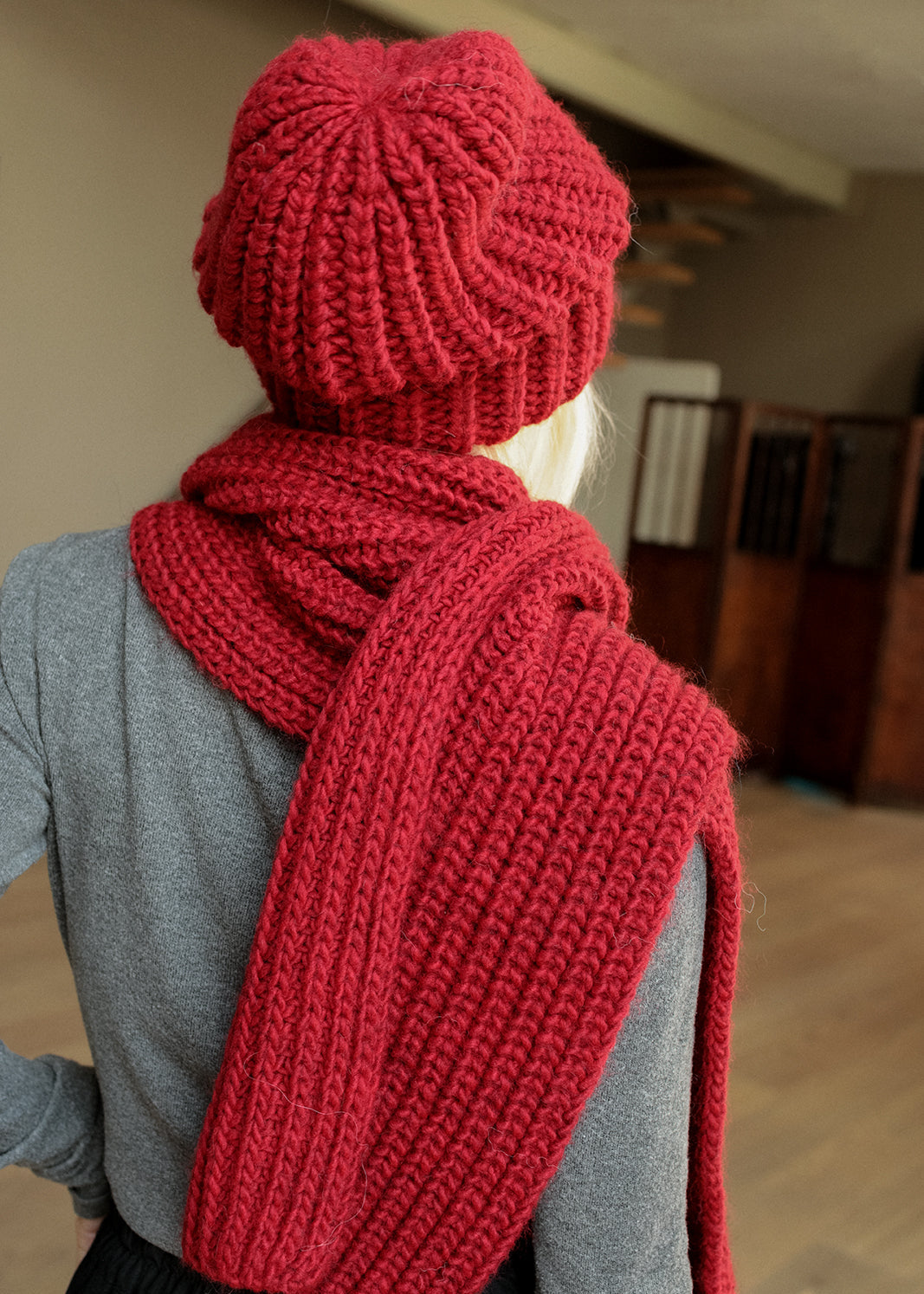 BRIKOLY London Burgundy knit beanie shown from the back with a matching scarf.