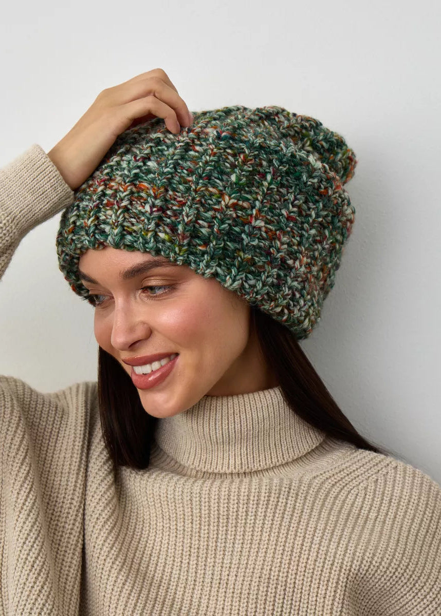 Oversized Green & Orange double-layer wool hat: Three-quarter portrait with a hand at the crown