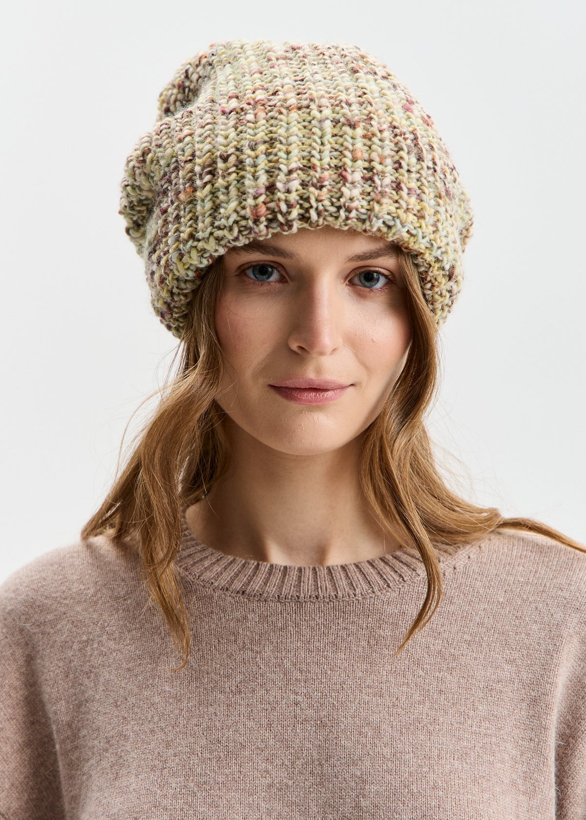 BRIKOLY London Yellow knit beanie shown in a front view on a model.