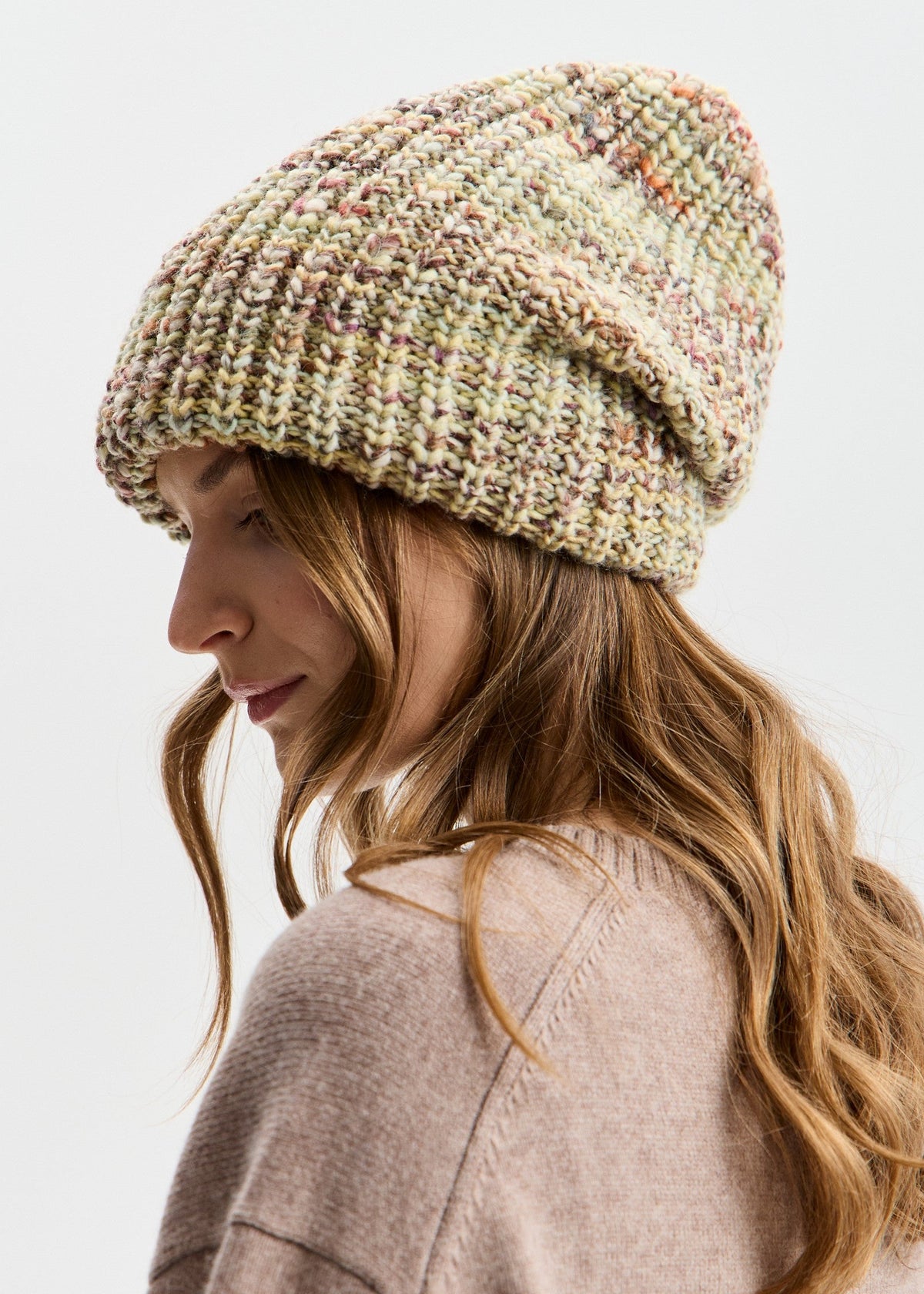 BRIKOLY London Yellow knit beanie shown in profile on a model.