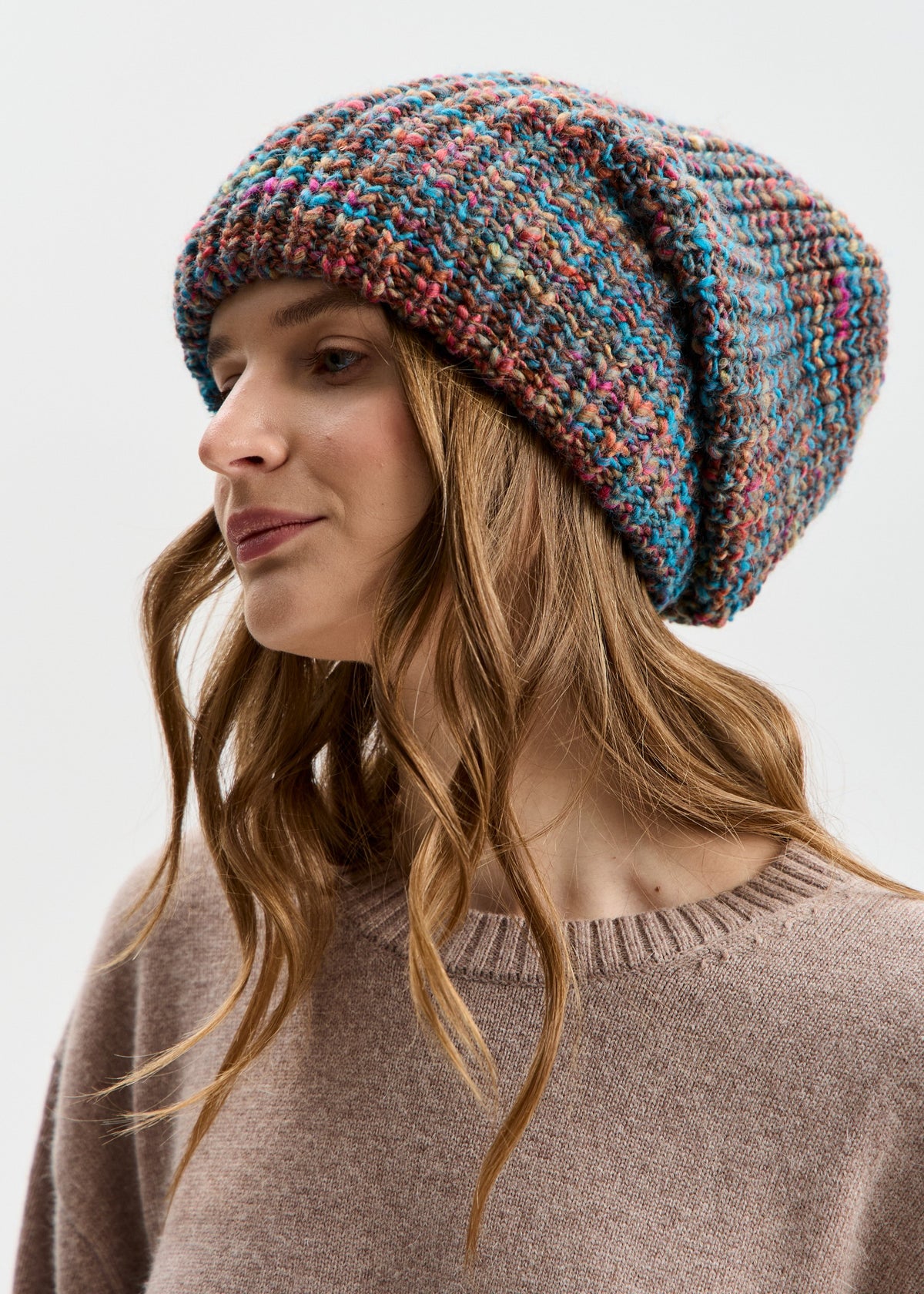 BRIKOLY London Turquoise multicolor knit beanie shown in profile to reveal its relaxed crown.