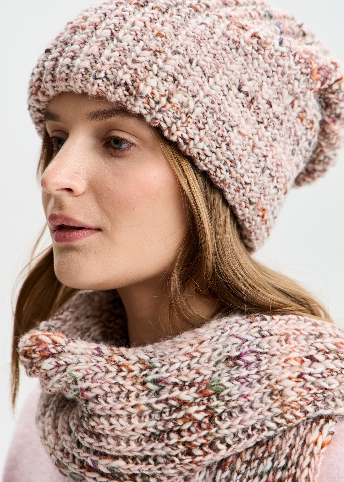 BRIKOLY London Beige multicolor knit beanie shown close up with a matching scarf.