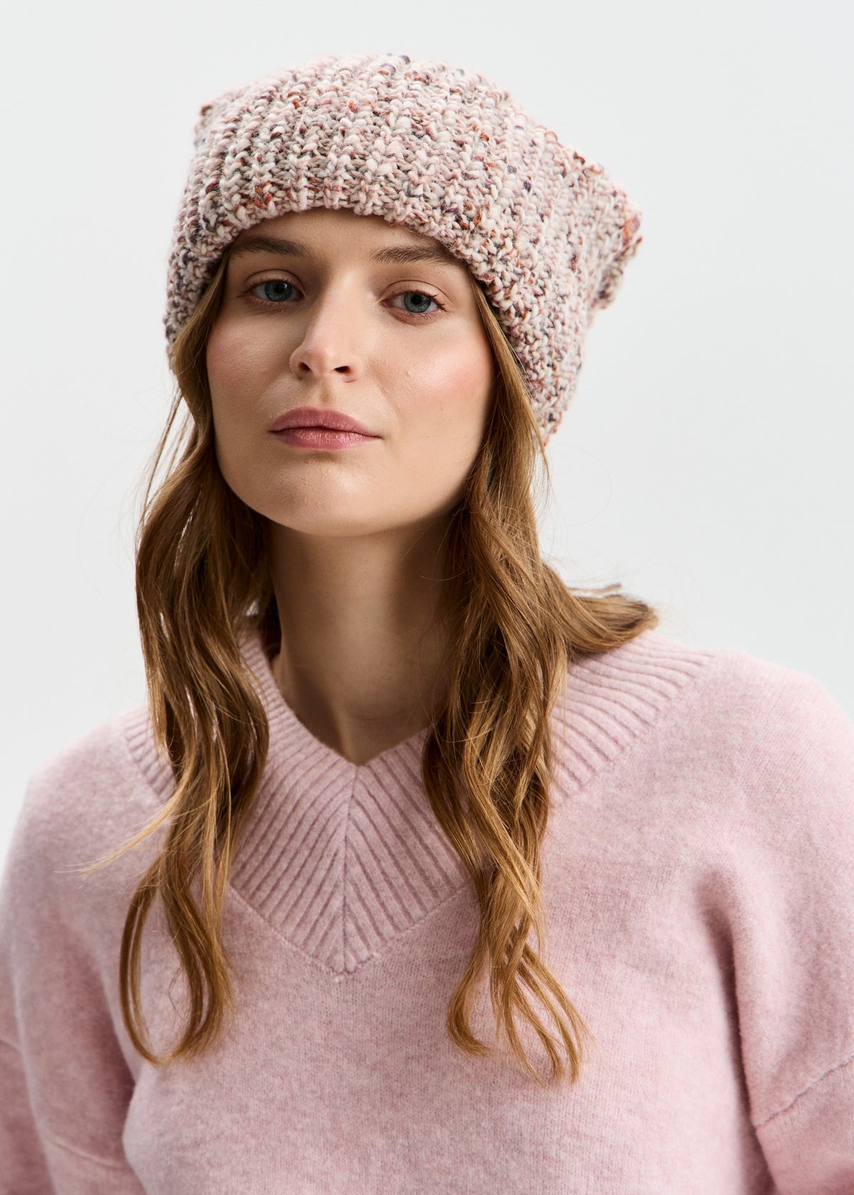 BRIKOLY London Beige multicolor knit beanie shown in a front view on a model.