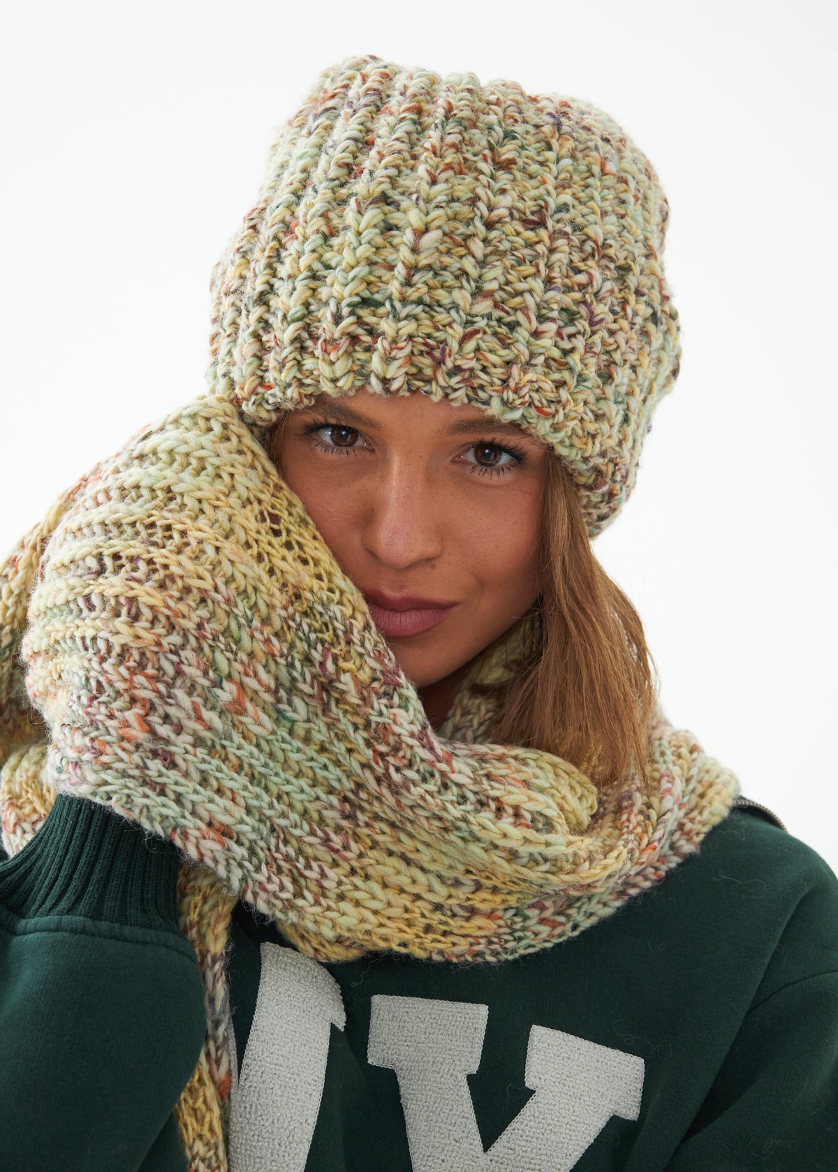 Oversized Yellow & Green alpaca-wool scarf: Close-up holding the knit near the face; beanie sold separately