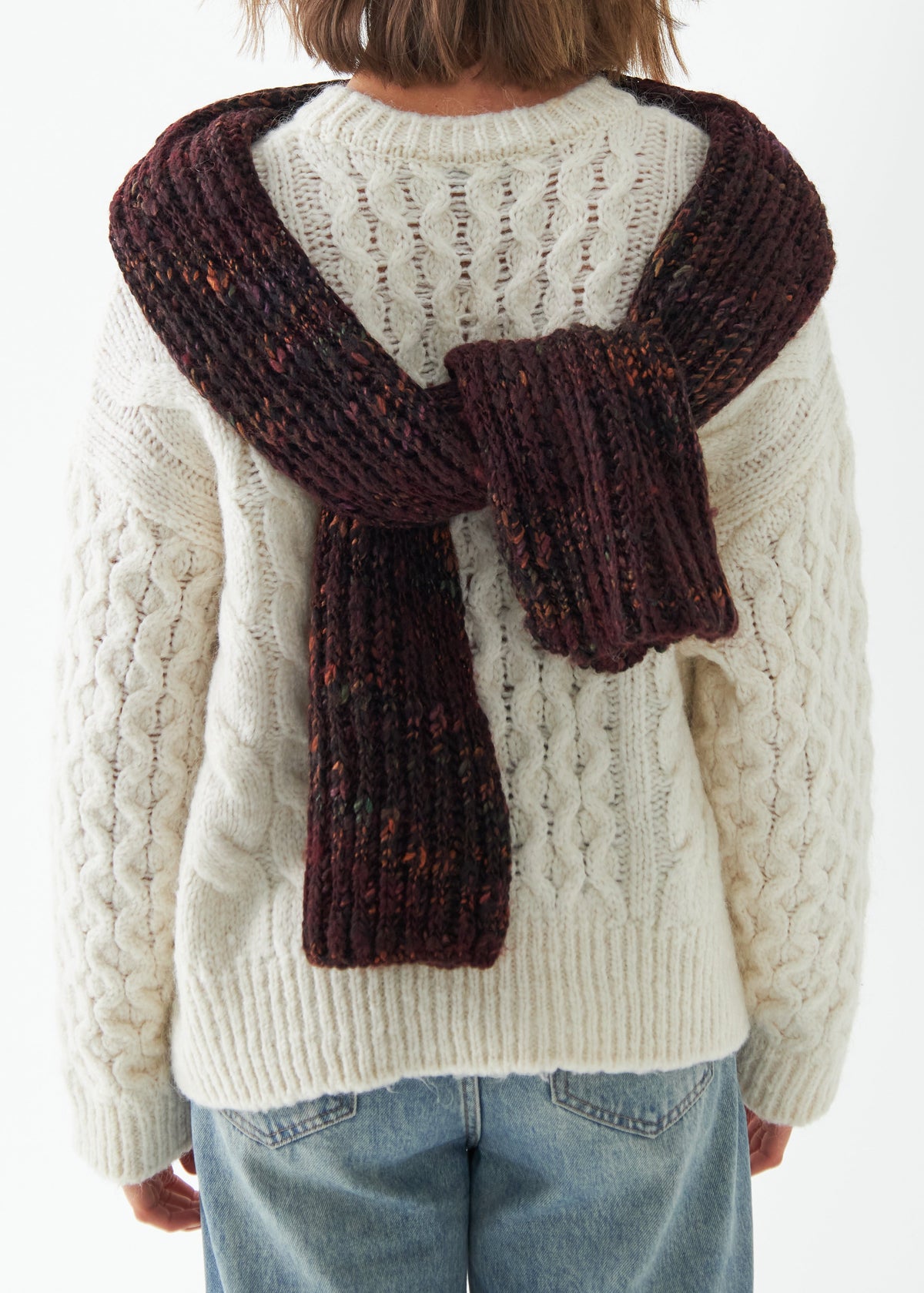 Oversized Maroon & Black alpaca-wool scarf: Back view with scarf tied behind the neck; beanie sold separately
