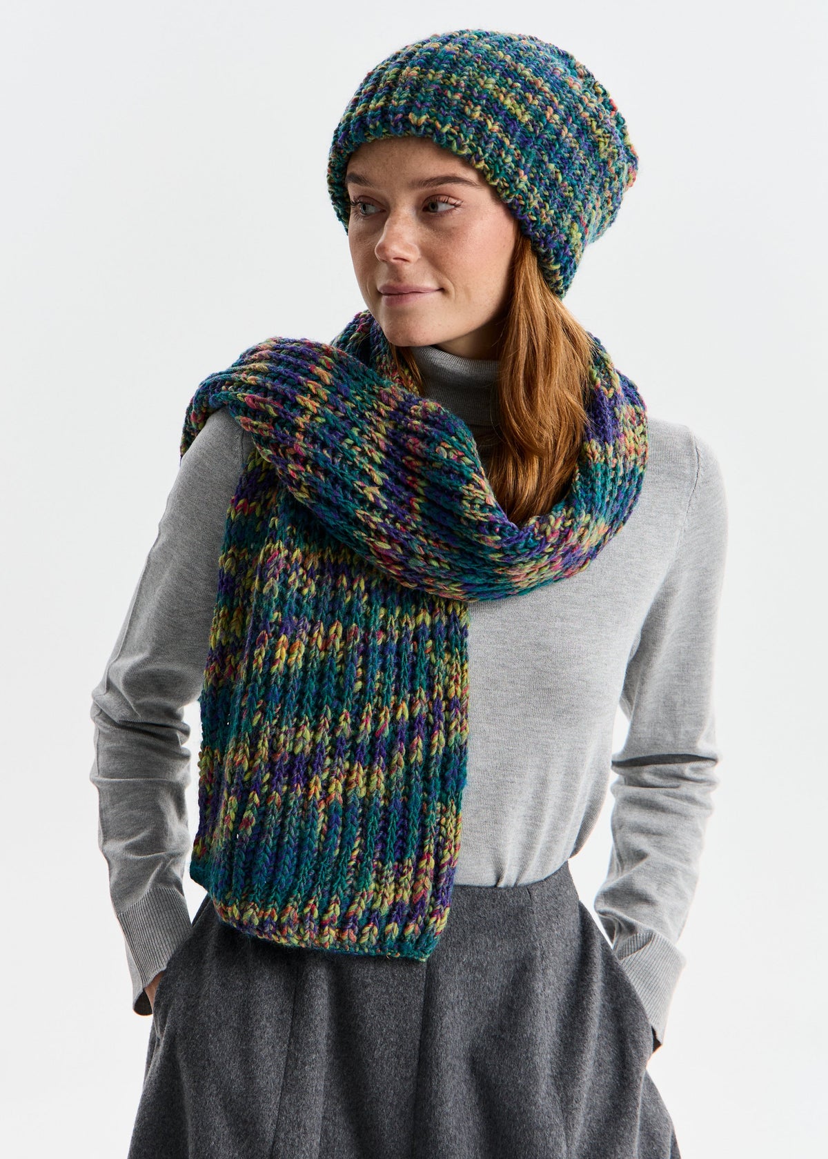 BRIKOLY London Lilac & Navy knit beanie shown on a model with a matching scarf hanging down the front.