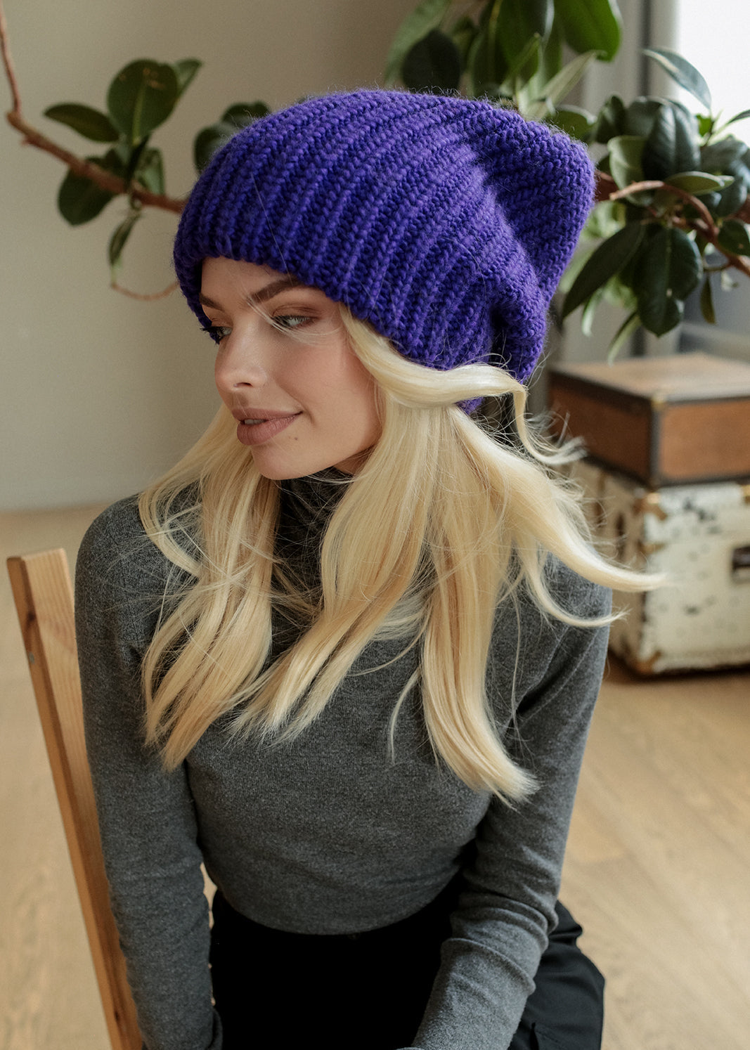 BRIKOLY London Lavender knit beanie worn by a model looking to the side.