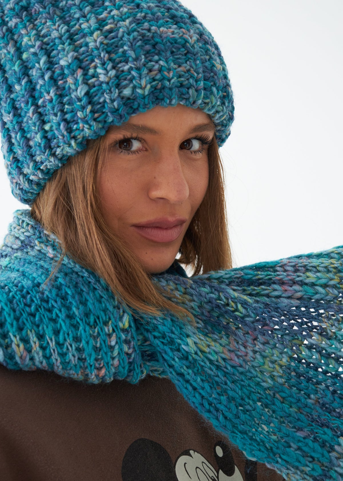 Oversized Tiffany alpaca-wool scarf: Close-up holding one end outward; beanie sold separately