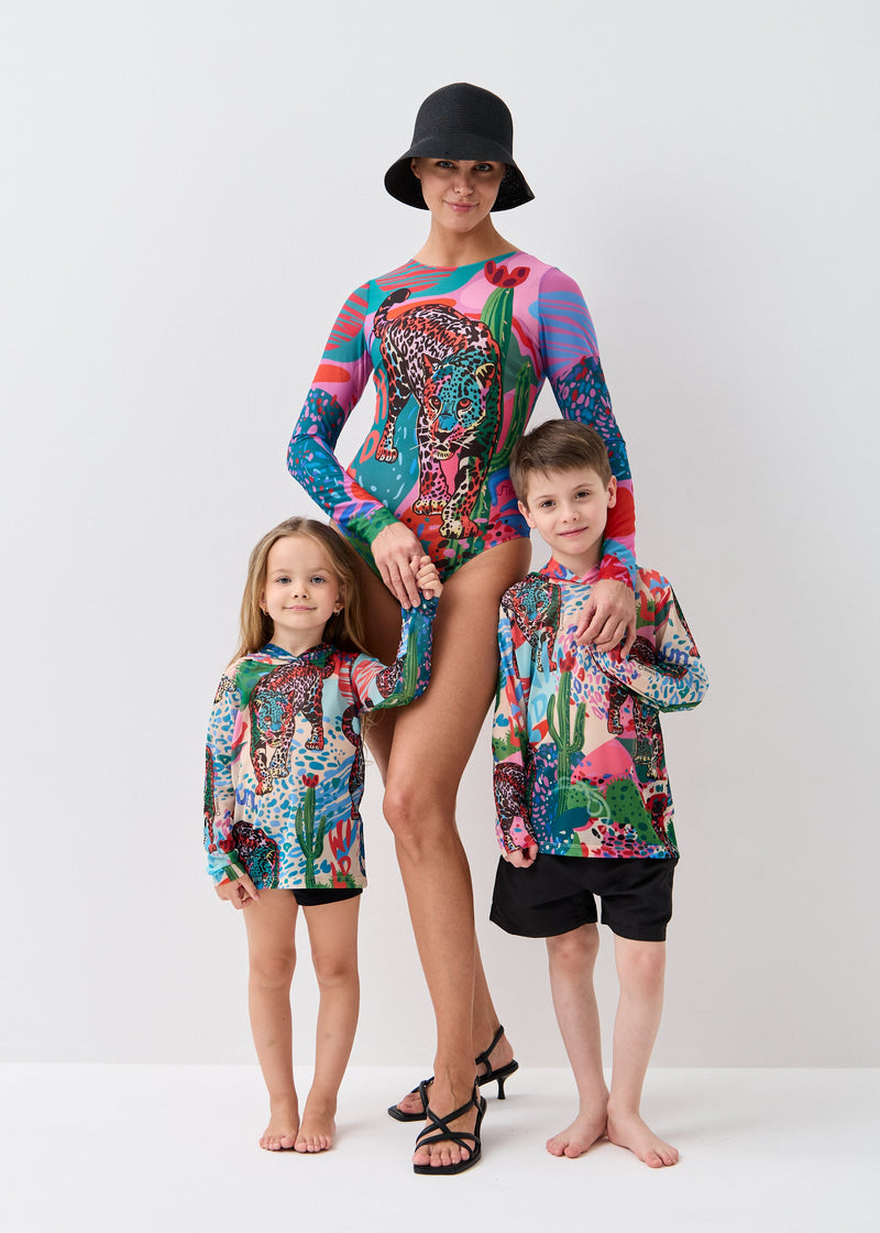 Woman and two children wearing colorful smart swimwear spf50 on a white background