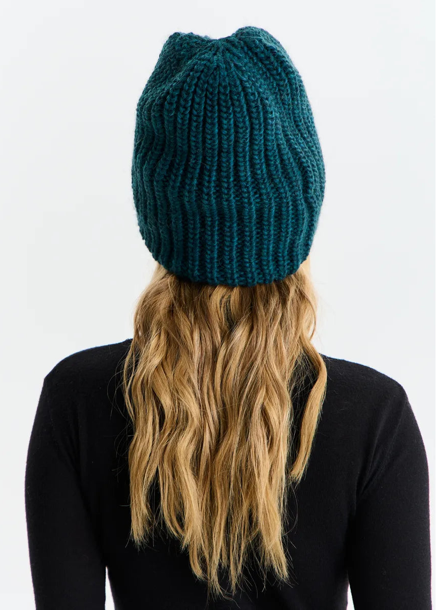 BRIKOLY London Emerald knit beanie shown from the back.