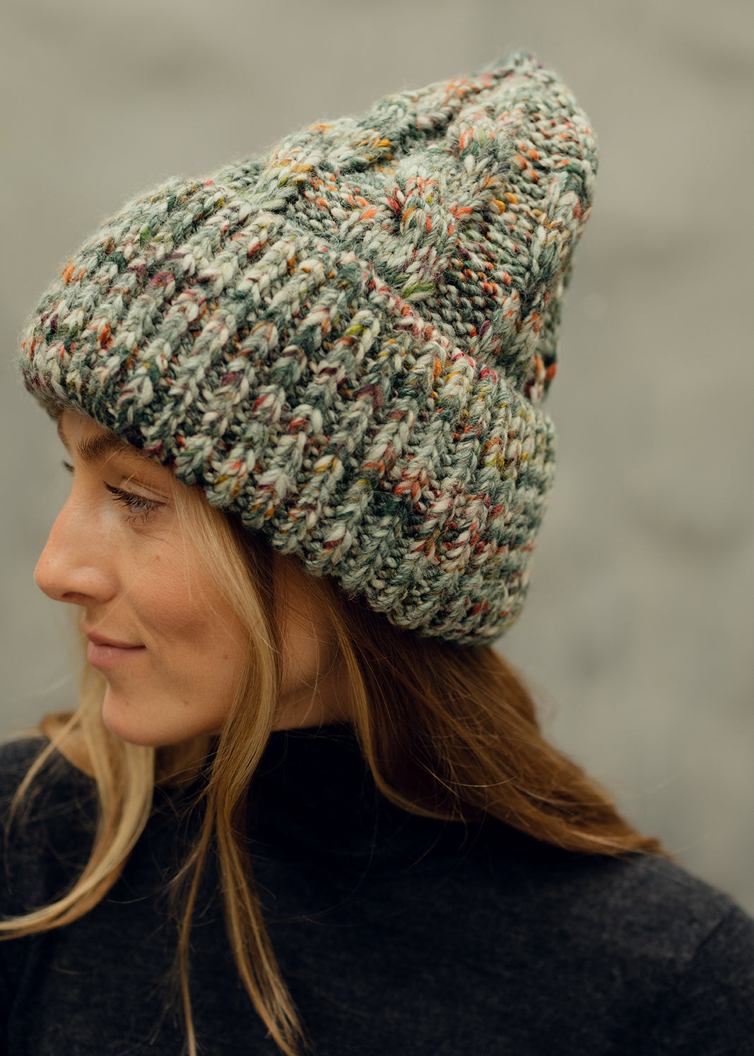 Tokyo Green cable knit wool beanie: Side profile showing the cable knit crown