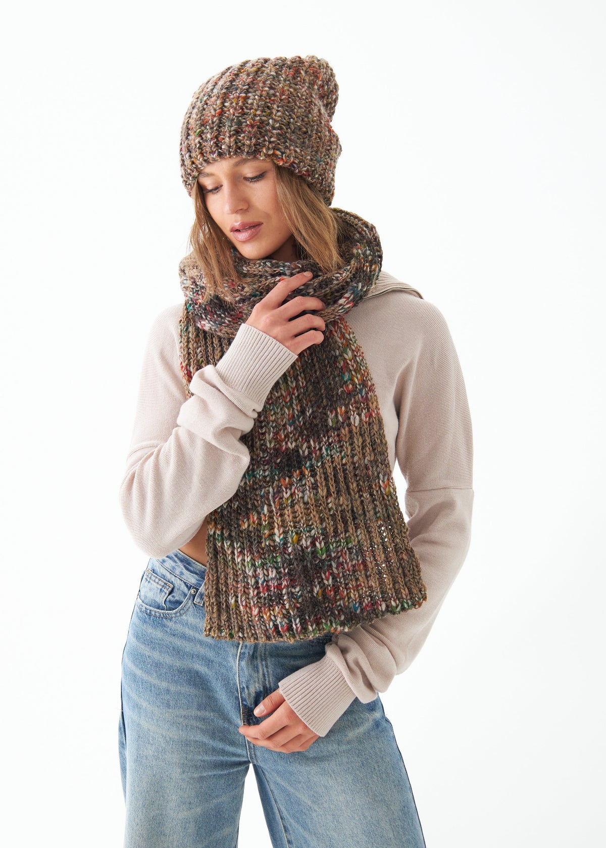 Oversized Multicolor alpaca-wool scarf: Looking-down outfit view holding the scarf; beanie sold separately