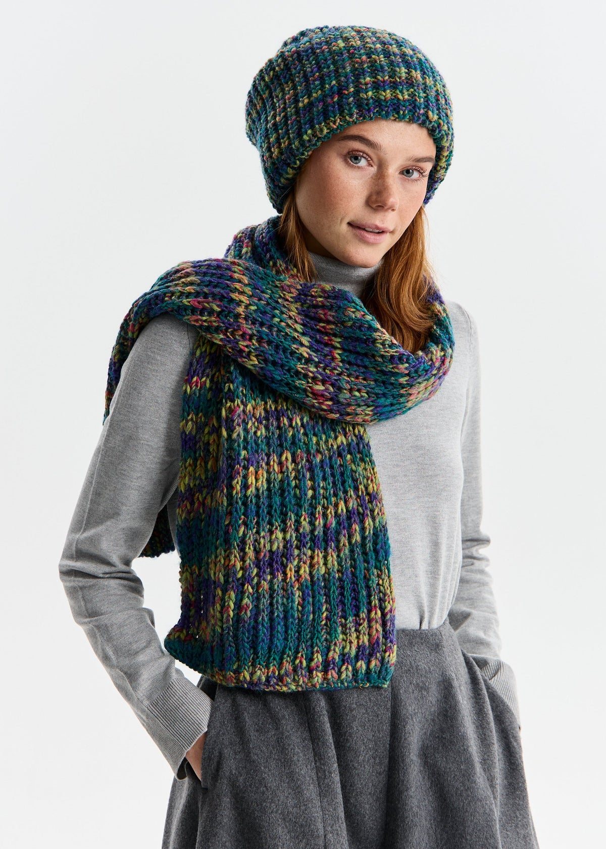 BRIKOLY London Lilac & Navy knit beanie styled with a matching scarf in a three-quarter view.