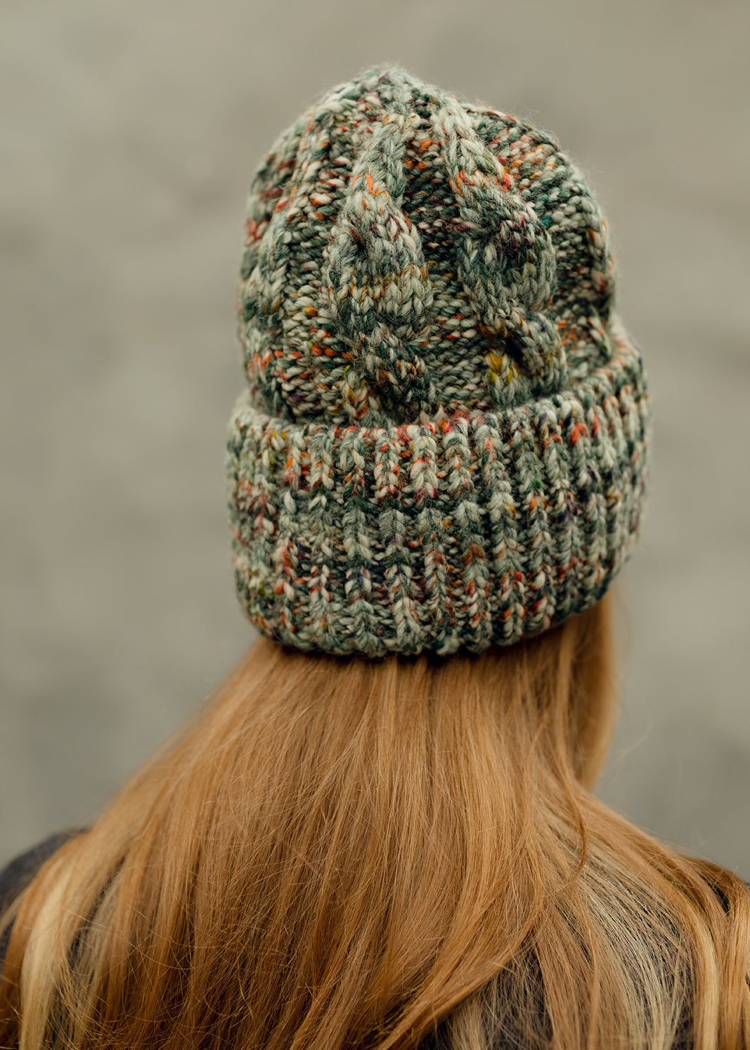 Tokyo Green cable knit wool beanie: Back view of the gathered crown