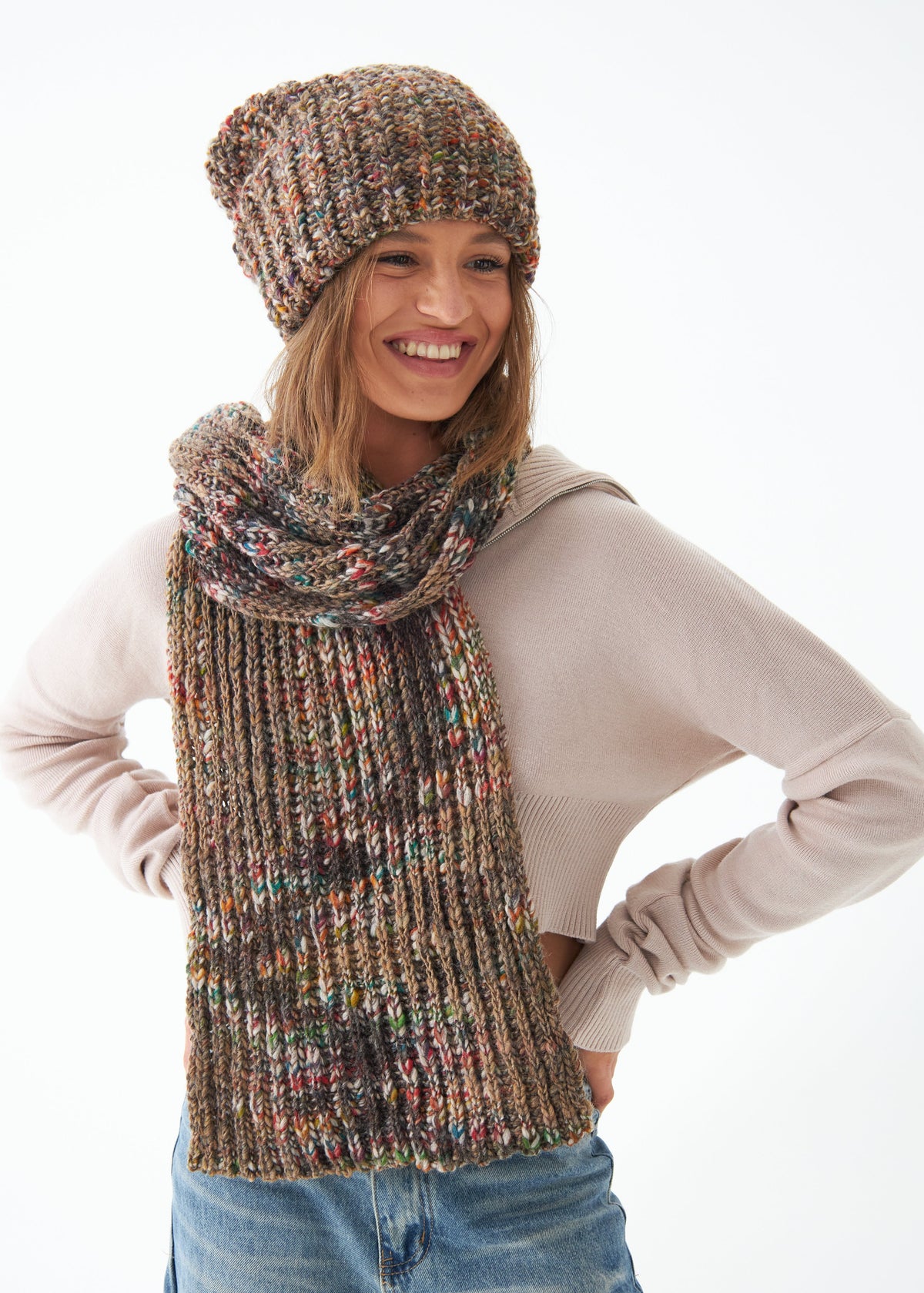 Oversized Multicolor alpaca-wool scarf: Smiling front portrait with matching beanie; beanie sold separately