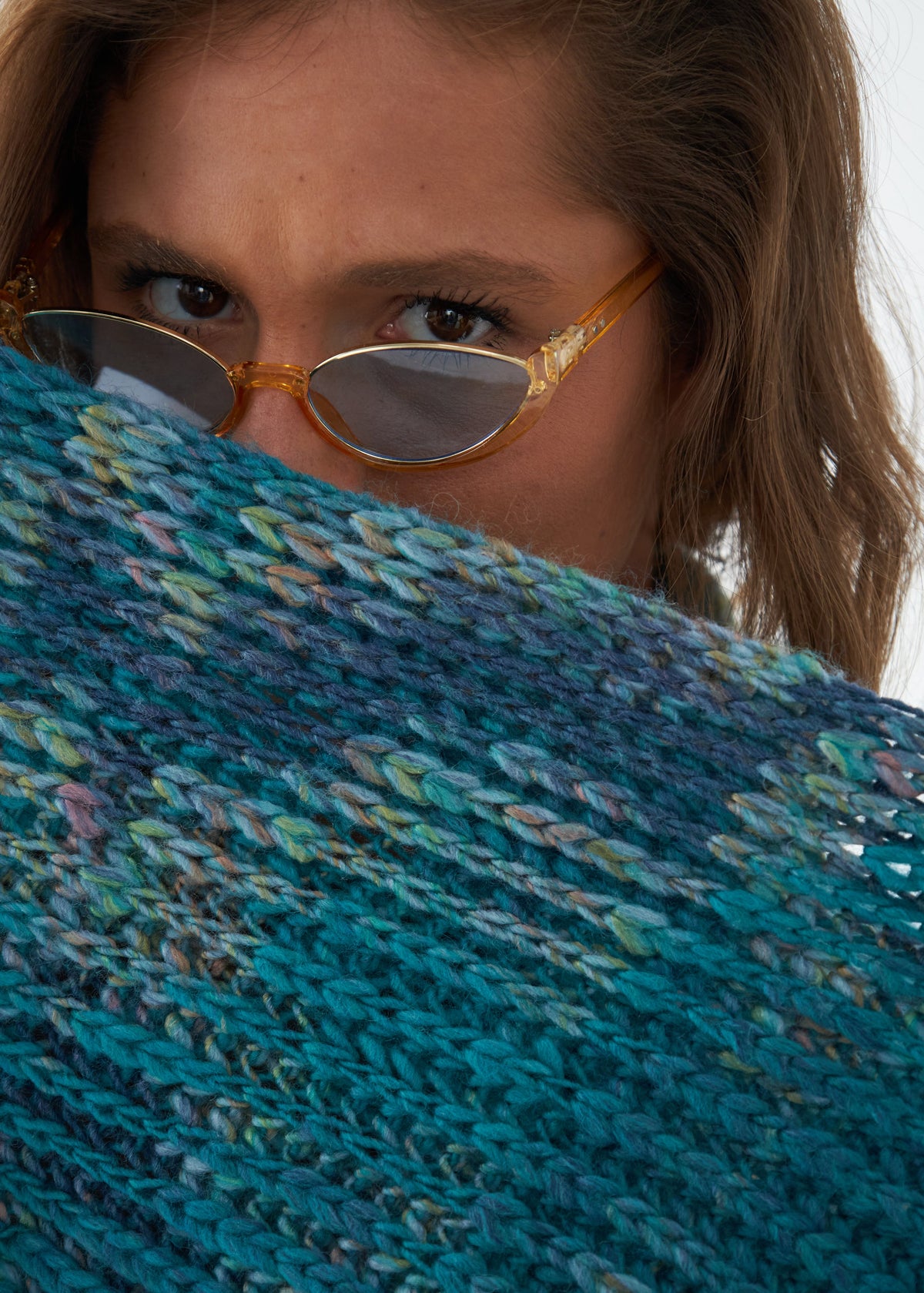 Oversized Tiffany alpaca-wool scarf: Close-up holding the knit near the face; beanie sold separately