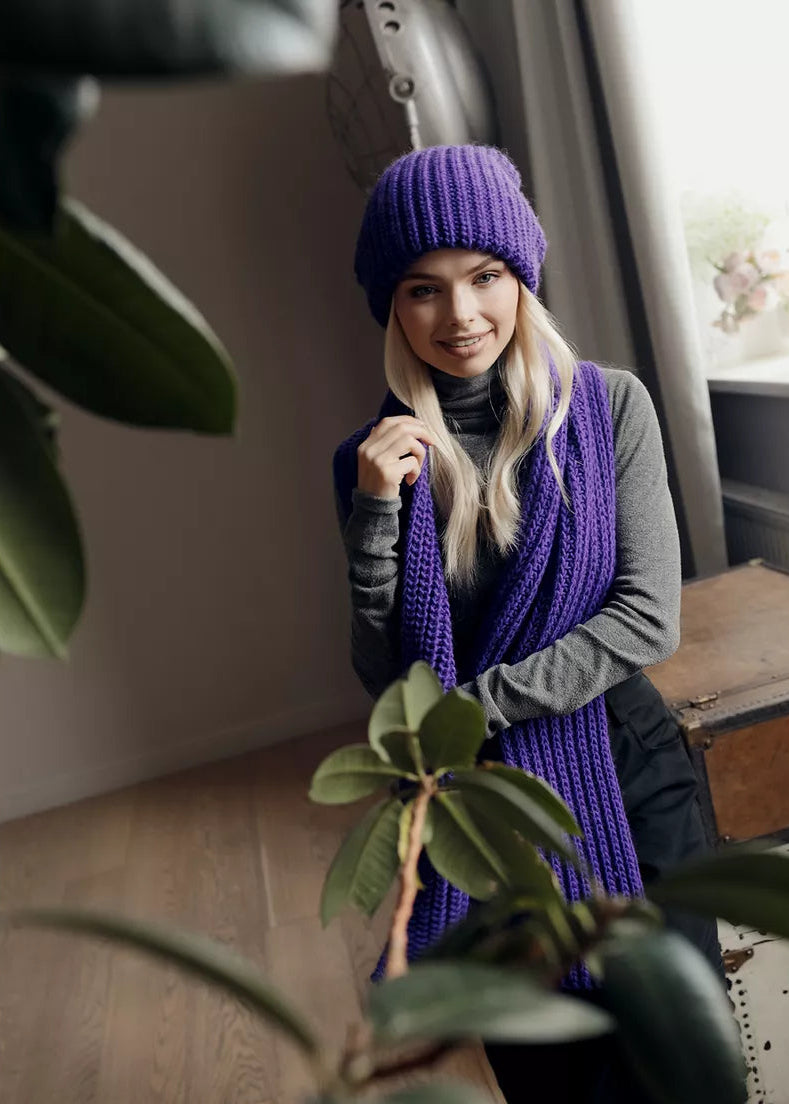 BRIKOLY London Lavender knit beanie styled with a matching scarf in a front view.