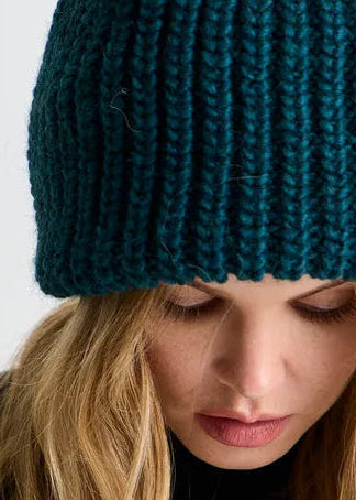 BRIKOLY London Emerald knit beanie shown in a detail view of the knit brim.