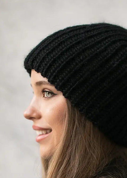 Oversized Black double-layer wool hat: Smiling side close-up