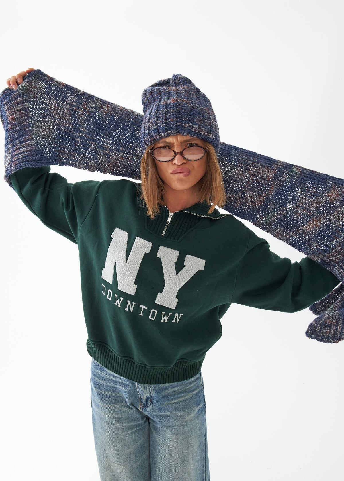 Oversized Lavender alpaca-wool scarf: Outfit view holding the scarf across the shoulders; beanie sold separately