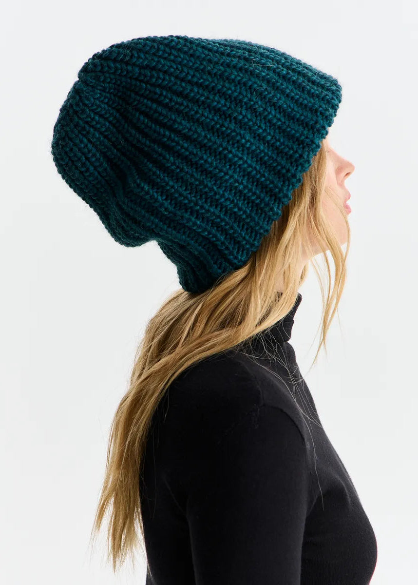 BRIKOLY London Emerald knit beanie shown in profile to reveal the relaxed crown.