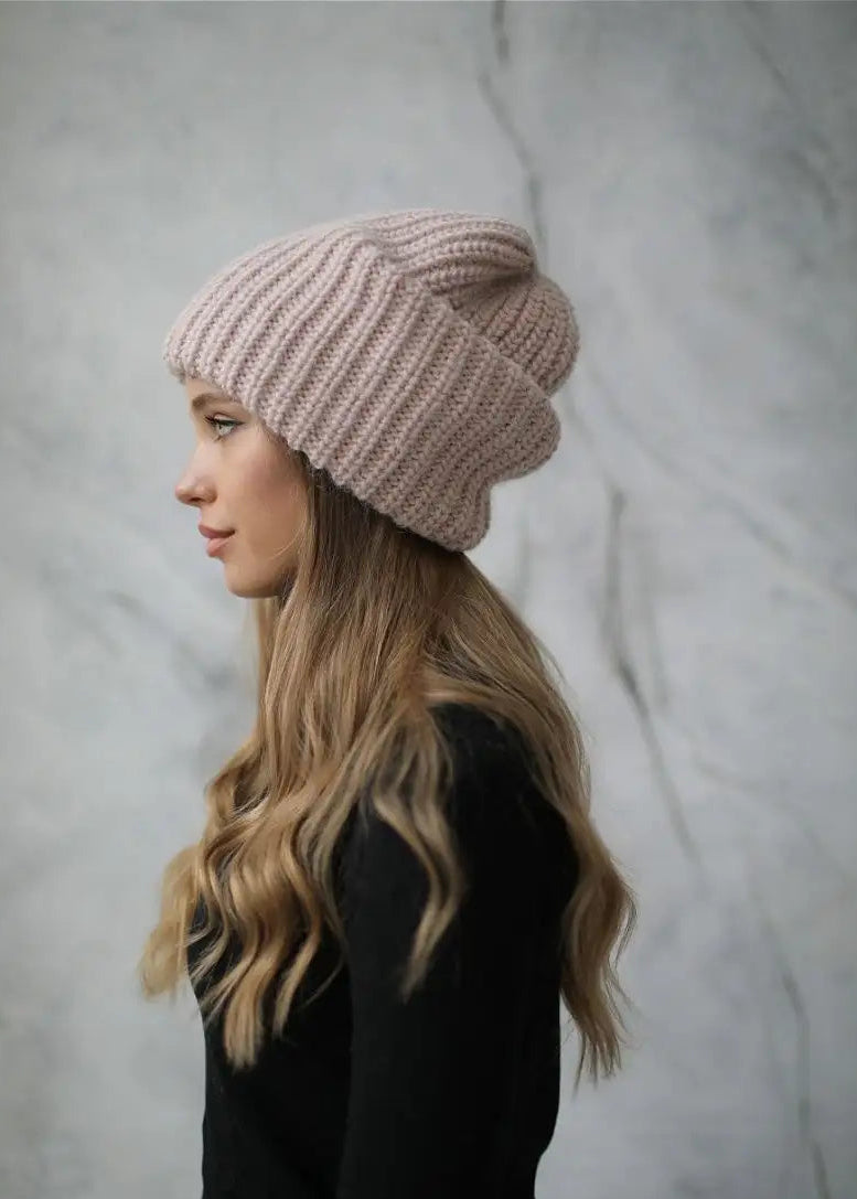 BRIKOLY London Pink knit beanie shown in profile on a model.