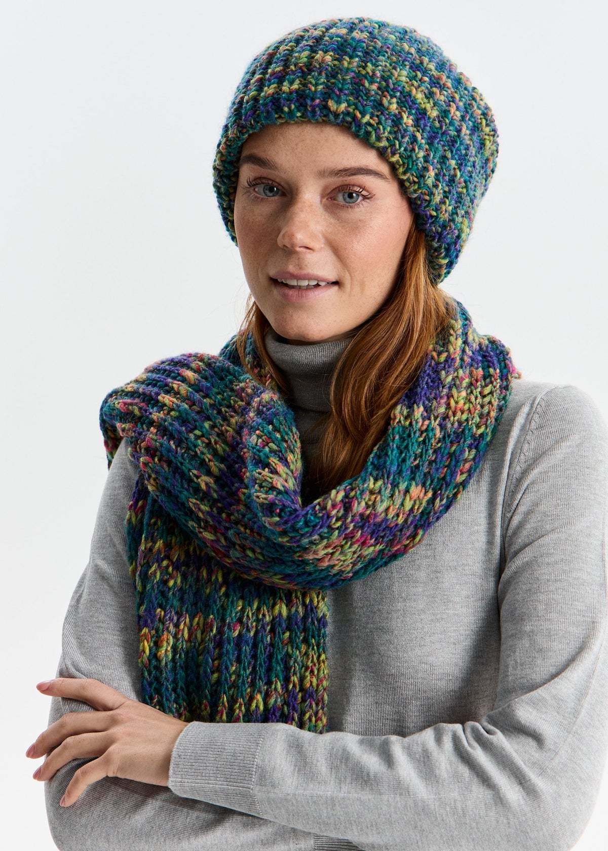 BRIKOLY London Lilac & Navy knit beanie worn by a model with arms crossed and a matching scarf.