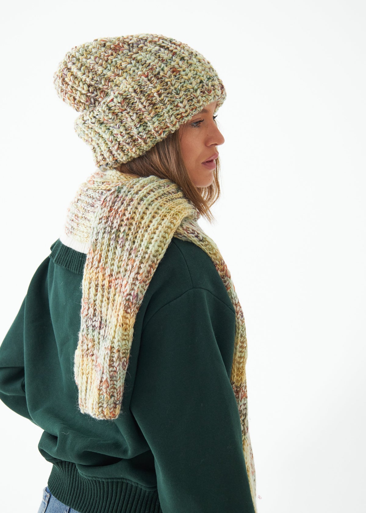 Oversized Yellow & Green alpaca-wool scarf: Side outfit view wrapped at the neck; beanie sold separately