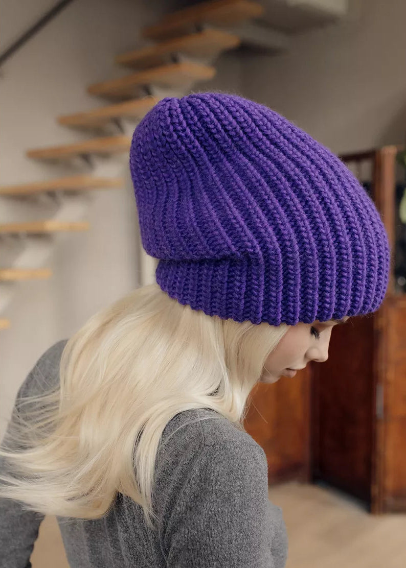 BRIKOLY London Lavender knit beanie shown close up on a model looking down.