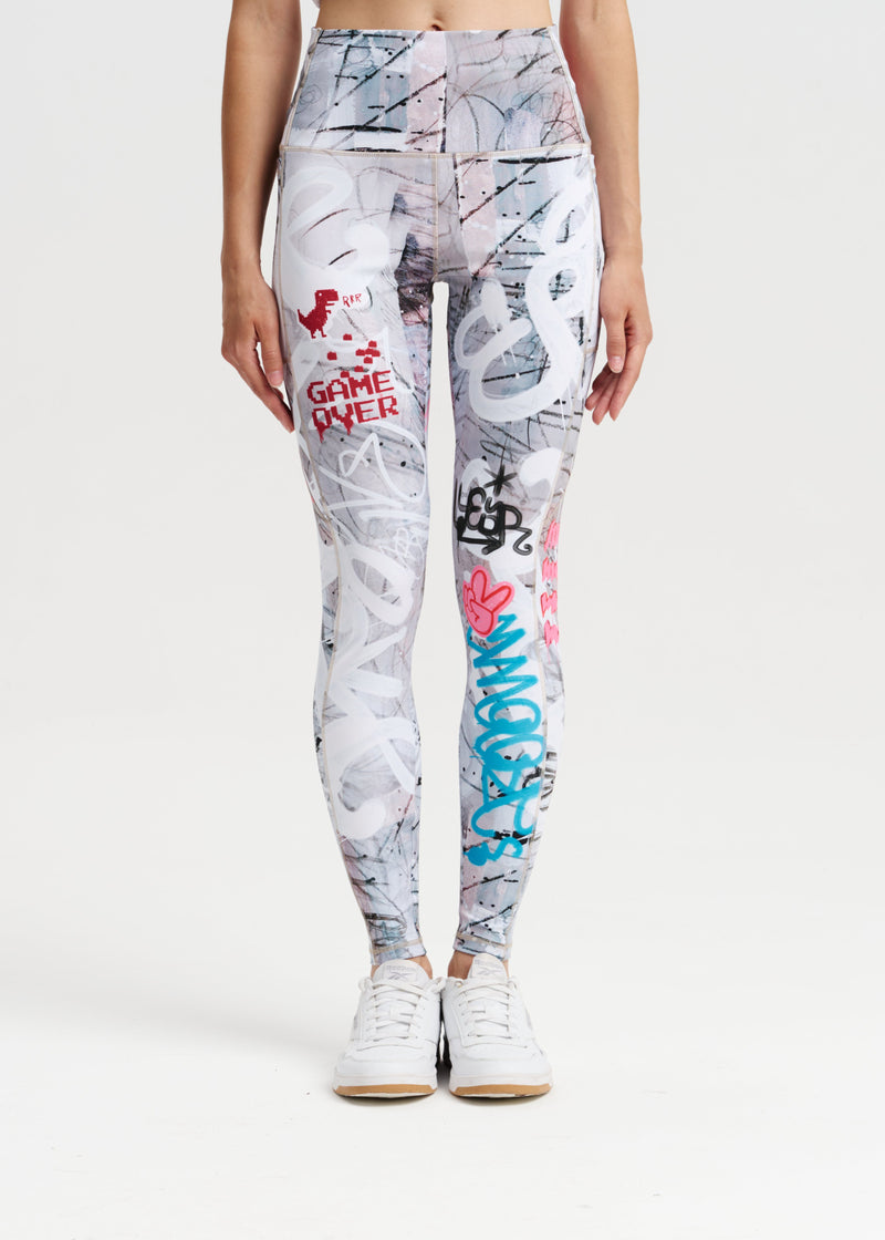 Leggings with colorful graffiti-style designs on a white background