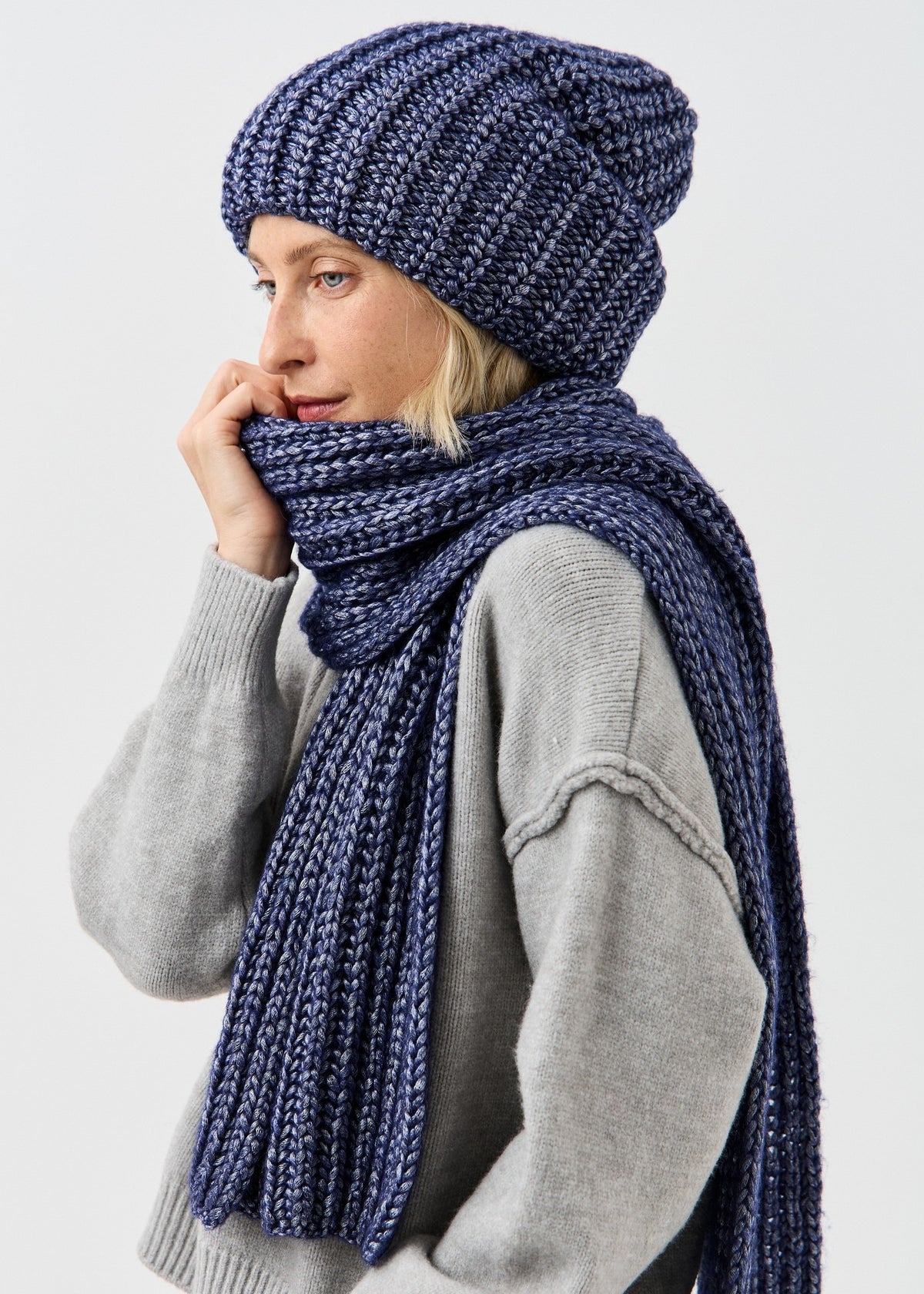 Lustre Denim Melange alpaca-wool scarf: Side close-up with scarf held near the face; beanie sold separately