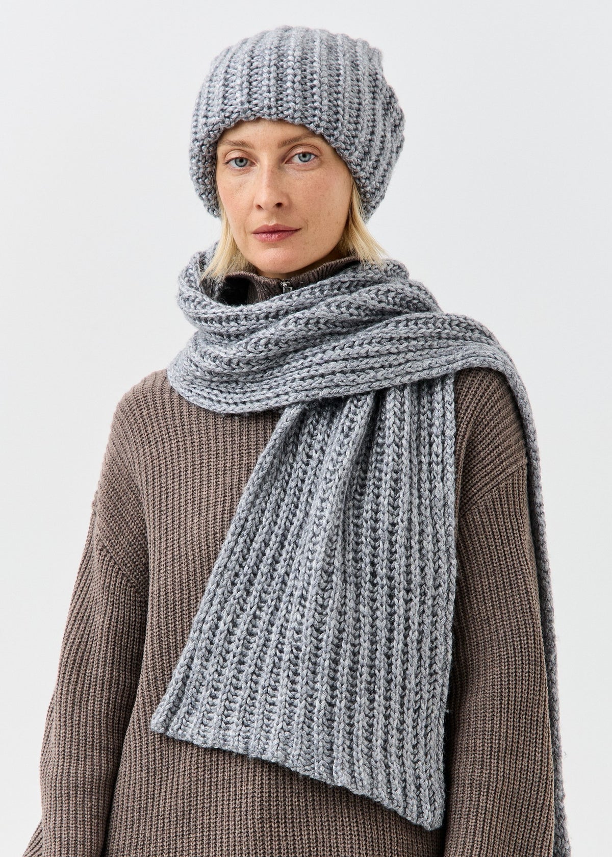 BRIKOLY Lustre Gray Melange knit scarf wrapped around a model's neck in a front view.