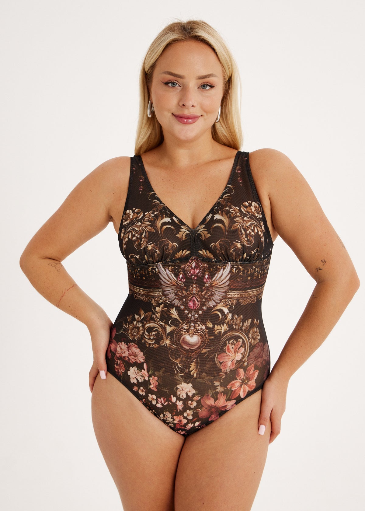 Woman wearing a smart spf50 swimsuit or bodysuit on a white background