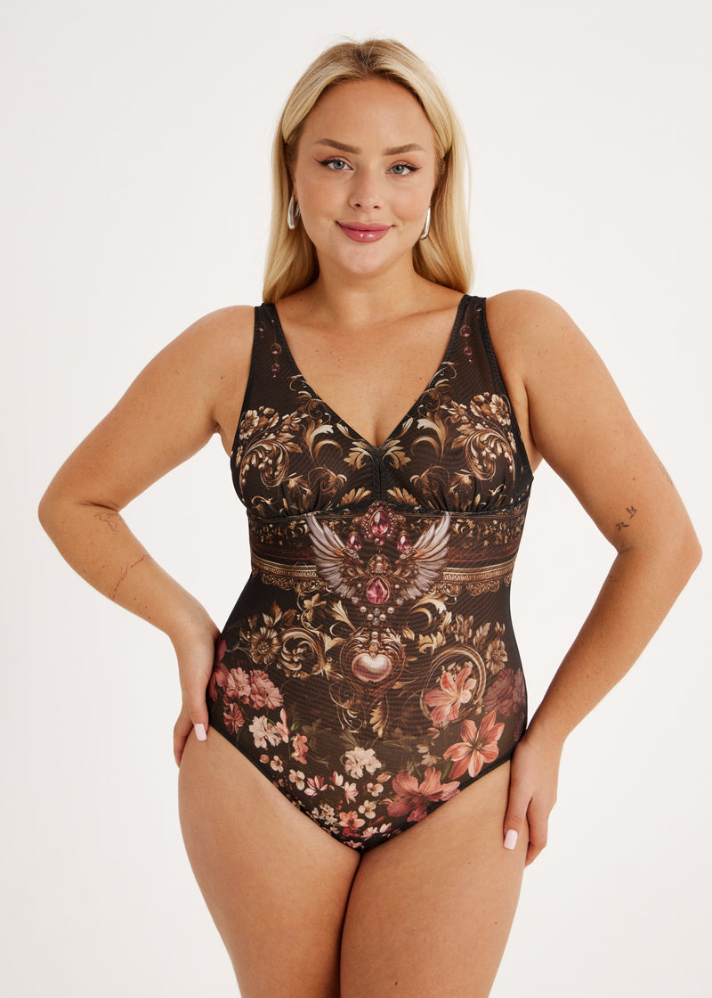 Woman wearing a smart spf50 swimsuit or bodysuit on a white background
